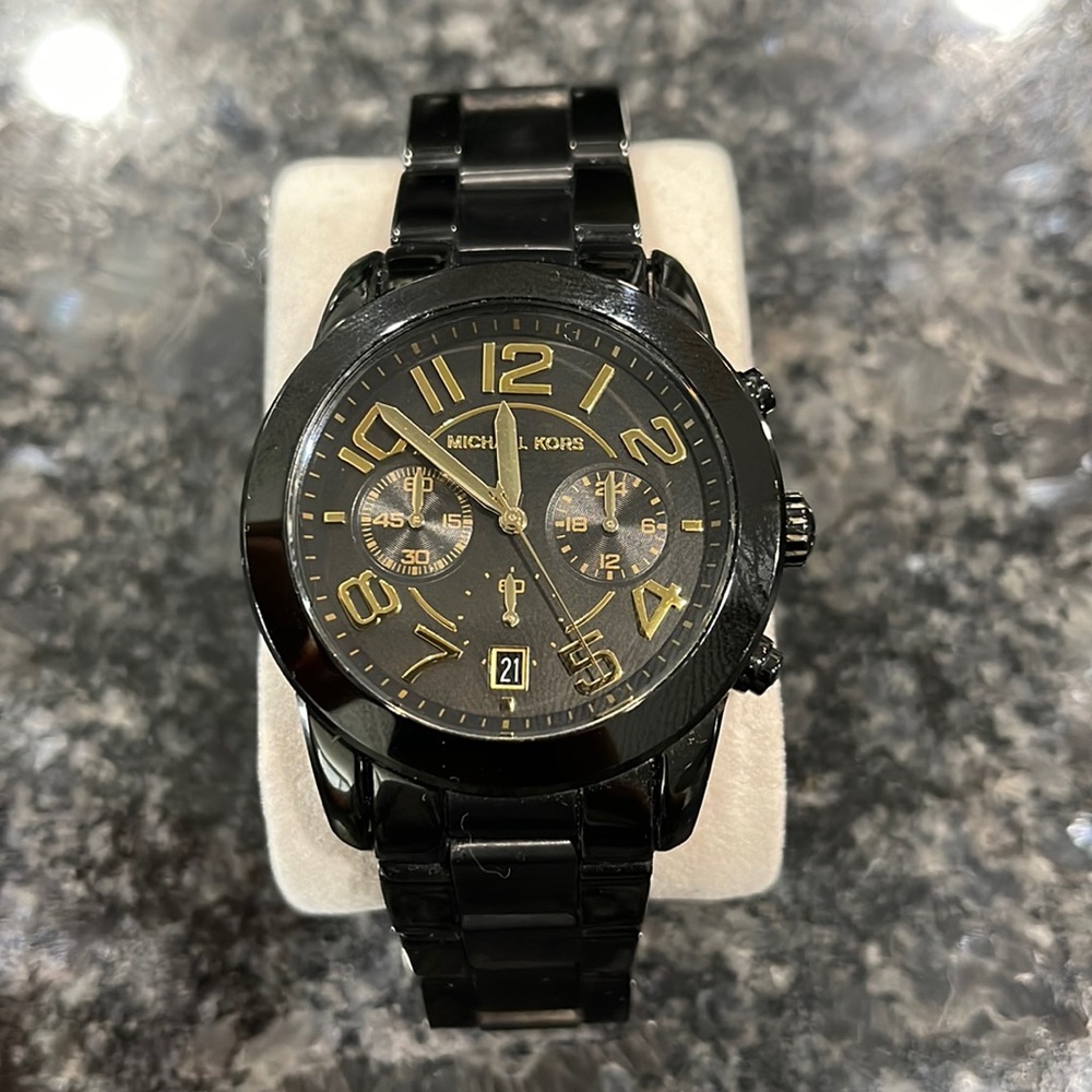 Used Michael Kors watch. Shows signs on wear. Needs a new battery